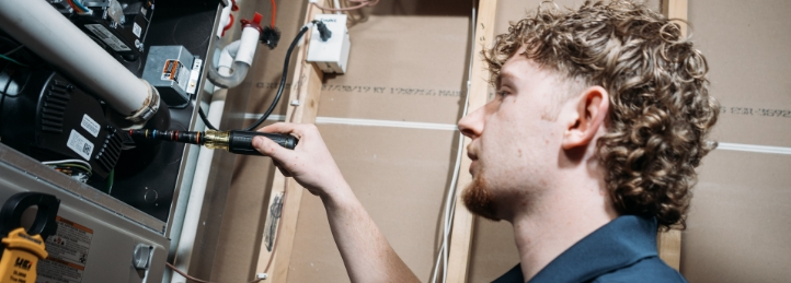 Tech working on a furnace.